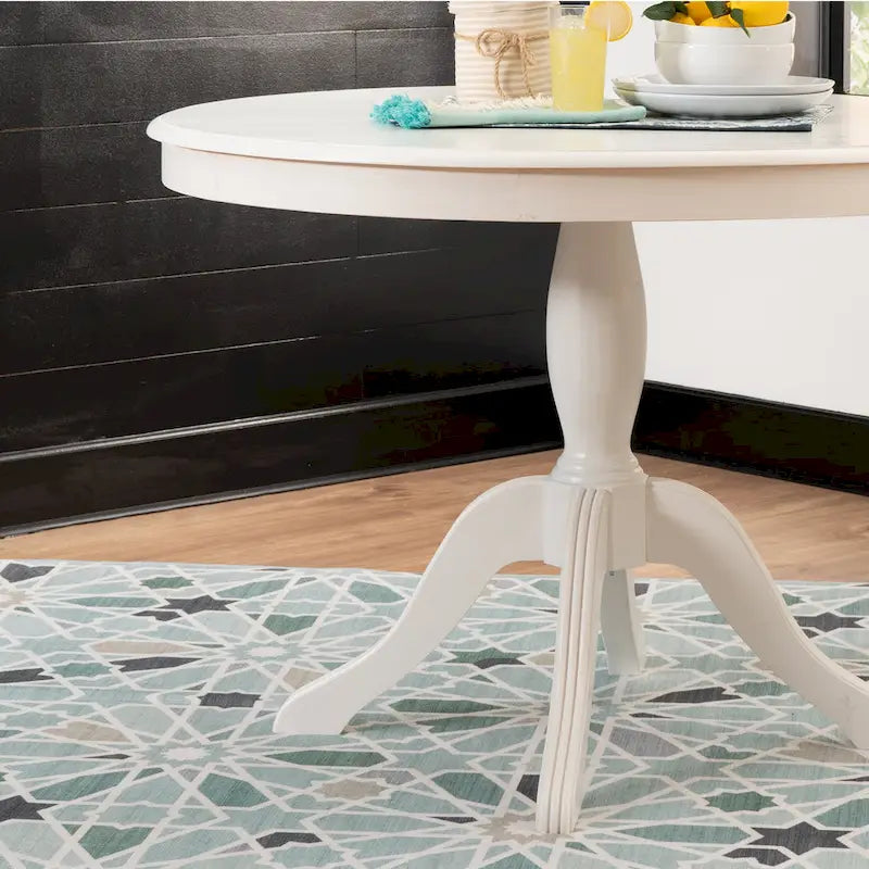 Table ronde à pied central en bois massif